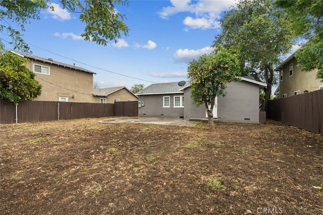 view of yard with a patio area and a fenced backyard