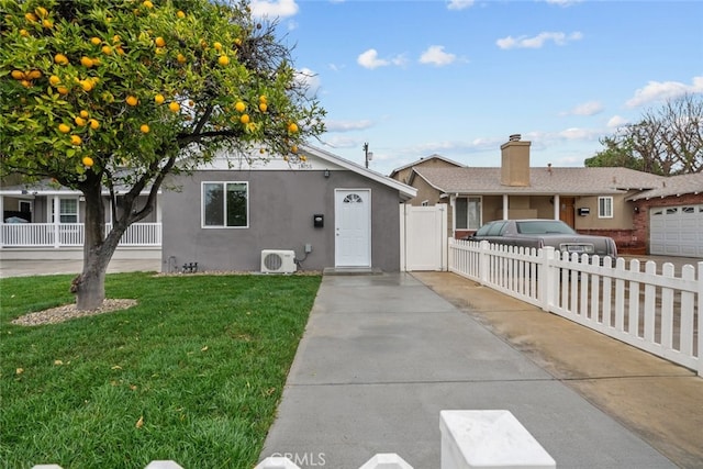 ranch-style house featuring a front lawn, ac unit, fence, and stucco siding