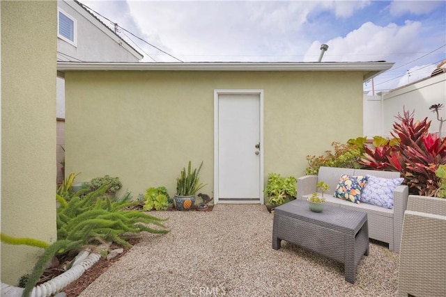 exterior space featuring stucco siding, fence, and a patio area