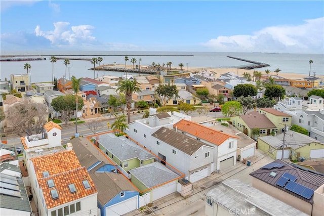 drone / aerial view featuring a residential view and a water view