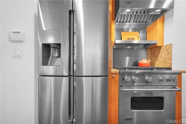 kitchen with premium range hood and appliances with stainless steel finishes