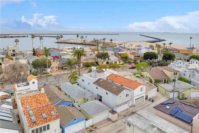 drone / aerial view with a residential view and a water view