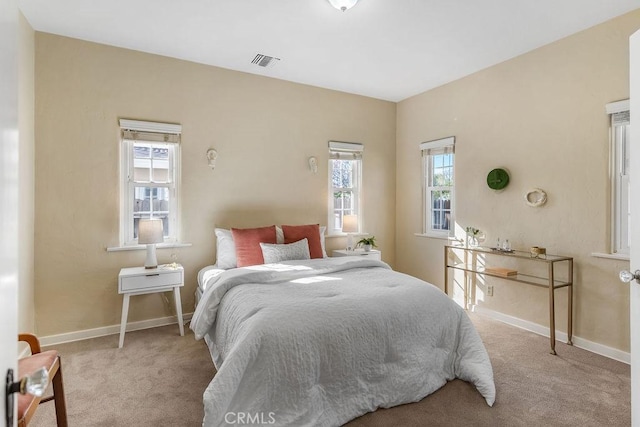 bedroom featuring carpet flooring, baseboards, and visible vents