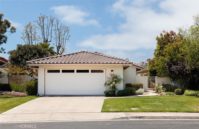 22902 Via Cruz, Laguna Niguel, CA 92677 - mediterranean / spanish home featuring concrete driveway, a tiled roof, an attached garage, and stucco siding