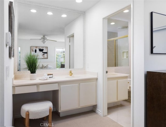 22902 Via Cruz, Laguna Niguel, CA 92677 - full bathroom featuring recessed lighting, ceiling fan, two vanities, tile patterned floors, and a shower with door