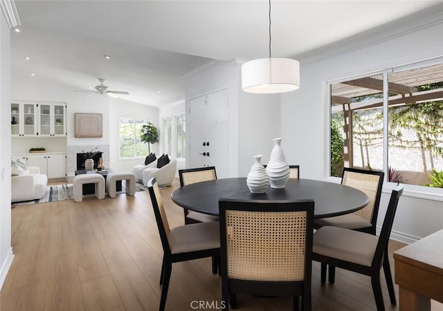 22902 Via Cruz, Laguna Niguel, CA 92677 - dining space featuring light wood finished floors, a ceiling fan, ornamental molding, vaulted ceiling, and recessed lighting