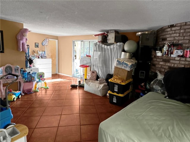 tiled bedroom featuring a textured ceiling