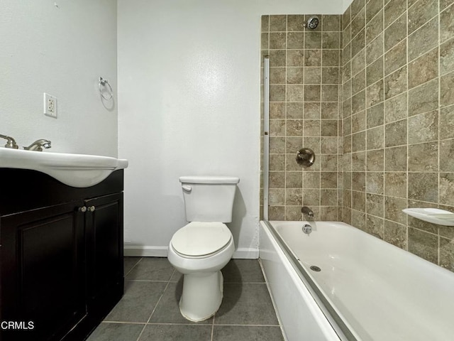 full bath with vanity, baseboards, tile patterned flooring, bathing tub / shower combination, and toilet