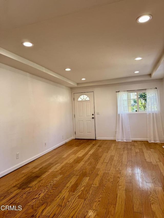 entrance foyer featuring recessed lighting, baseboards, and wood finished floors