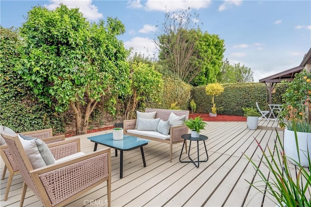 wooden deck featuring outdoor lounge area