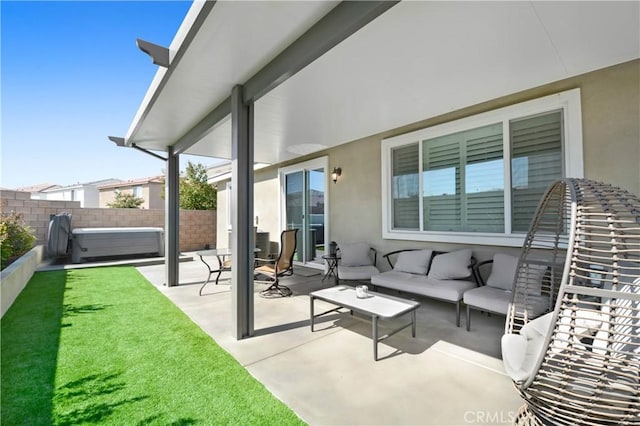 view of patio featuring outdoor lounge area and a fenced backyard