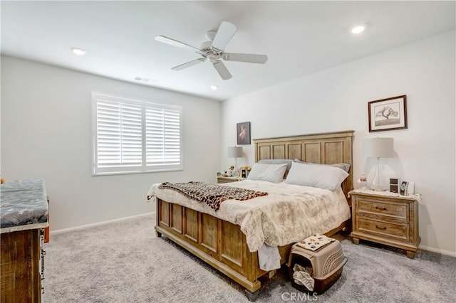 bedroom with recessed lighting, light colored carpet, baseboards, and ceiling fan