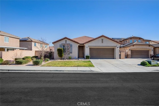 view of front of property featuring fence, driveway, stucco siding, a front lawn, and a garage