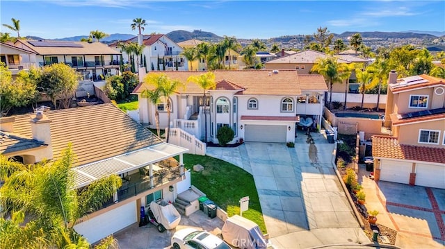 birds eye view of property featuring a mountain view and a residential view
