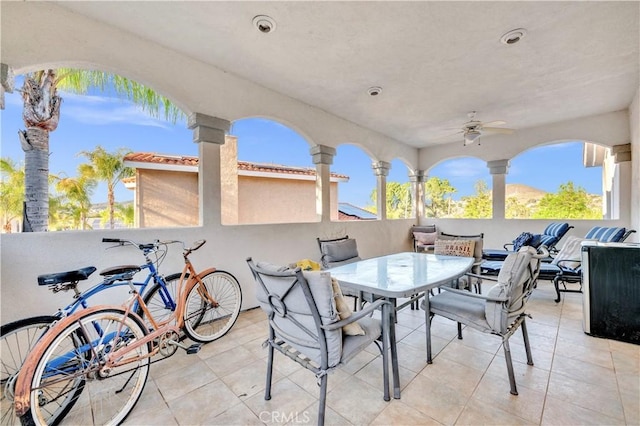 view of patio featuring an outdoor living space, outdoor dining space, and ceiling fan