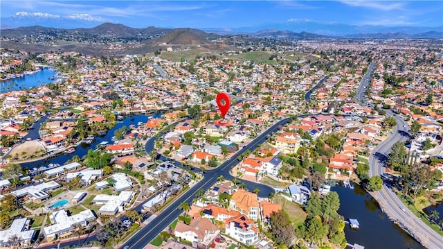 bird's eye view with a residential view and a water and mountain view