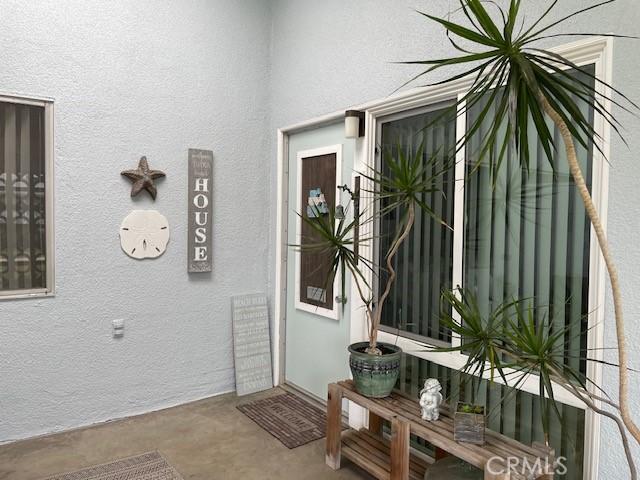 doorway to property with stucco siding