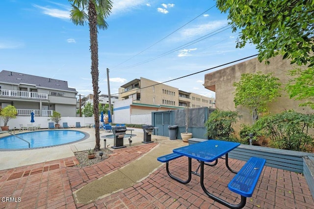 view of pool featuring a patio area, a fenced in pool, and fence