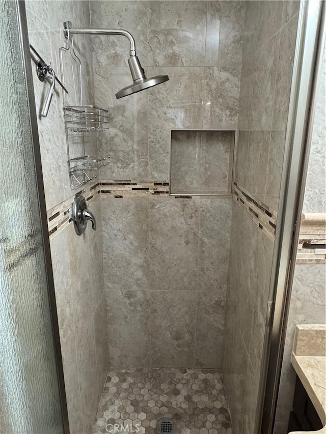 bathroom featuring a stall shower