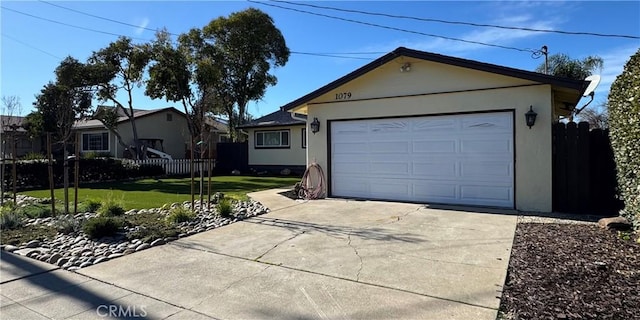 ranch-style home with stucco siding, concrete driveway, a front yard, and fence