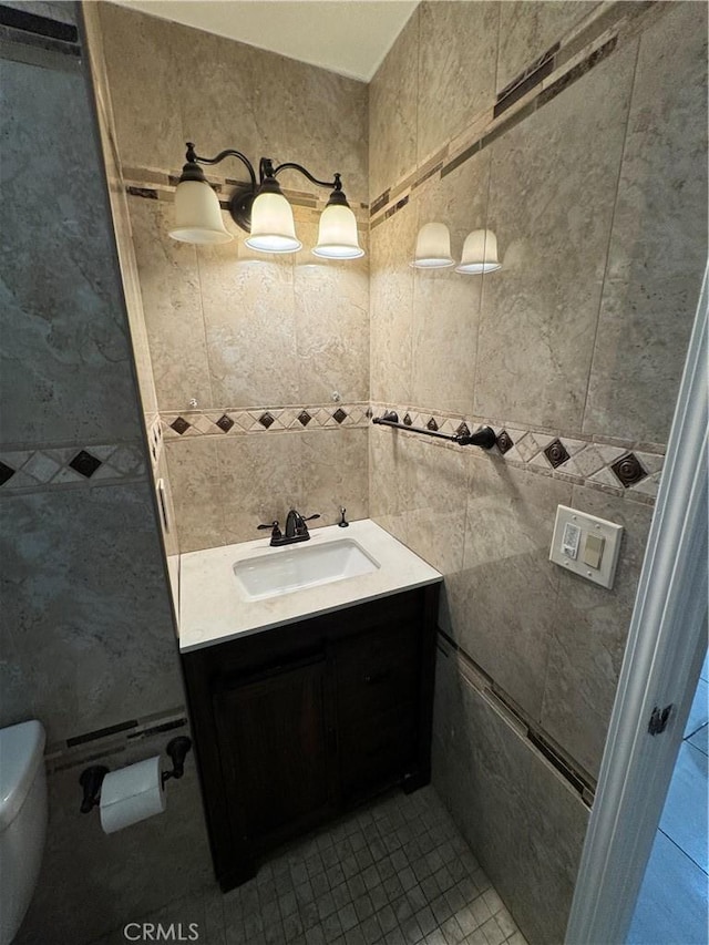 bathroom featuring toilet and vanity