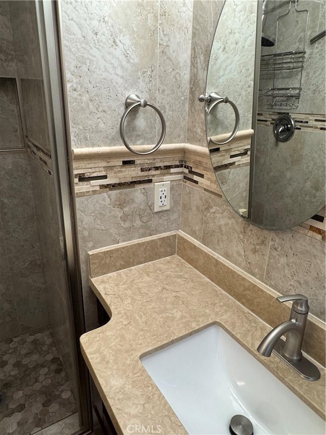 bathroom featuring vanity and a stall shower