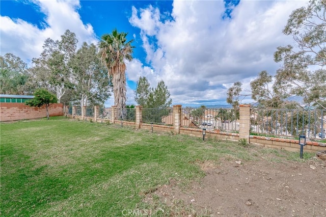 view of yard featuring fence