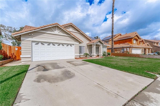 view of front of property featuring fence, a front lawn, concrete driveway, a garage, and a tiled roof