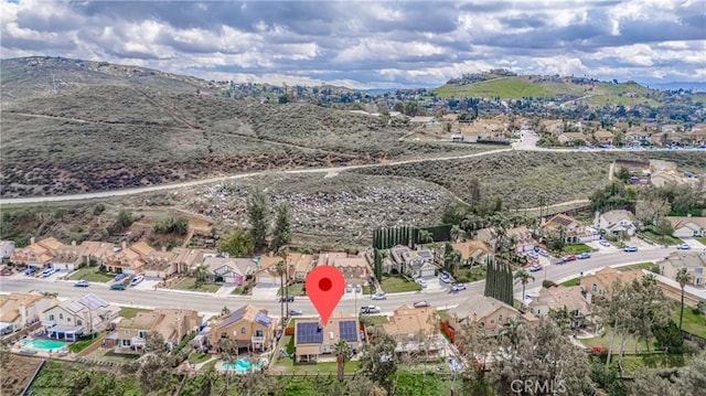 drone / aerial view featuring a mountain view and a residential view