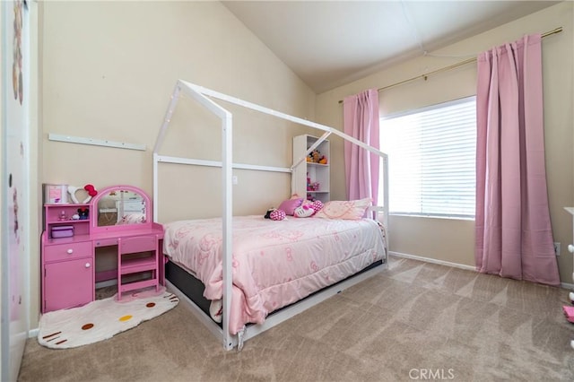 bedroom featuring carpet and vaulted ceiling