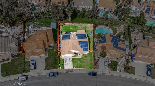 birds eye view of property with a residential view