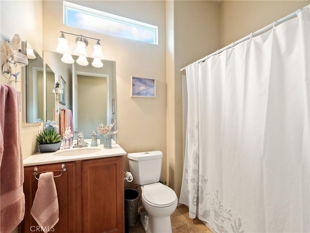 full bath featuring curtained shower, toilet, vanity, and tile patterned flooring