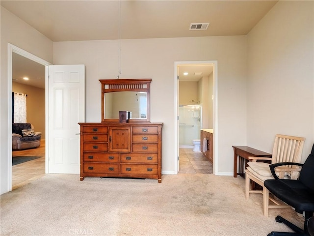 living area with visible vents, light colored carpet, and baseboards