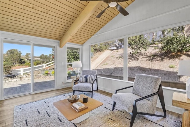 sunroom with wooden ceiling, vaulted ceiling with beams, and a ceiling fan