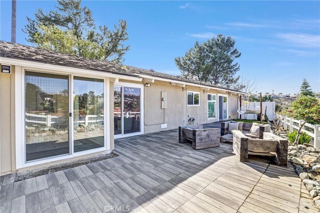 wooden deck featuring an outdoor living space