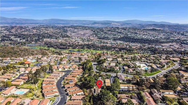 birds eye view of property with a mountain view and a residential view