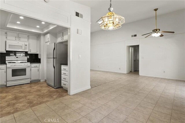 8933 Amador Cir Unit 1316E, Huntington Beach, CA 92646 - kitchen with white appliances, open floor plan, a ceiling fan, decorative backsplash, and recessed lighting