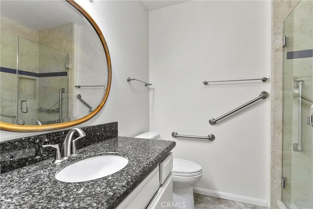 8933 Amador Cir Unit 1316E, Huntington Beach, CA 92646 - full bathroom featuring a shower stall, vanity, toilet, tile patterned flooring, and baseboards