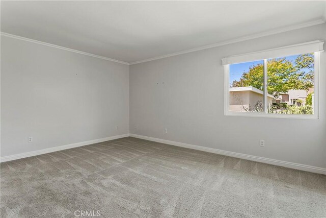 8933 Amador Cir Unit 1316E, Huntington Beach, CA 92646 - carpeted spare room with crown molding and baseboards