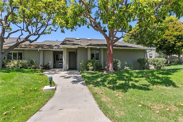 8933 Amador Cir Unit 1316E, Huntington Beach, CA 92646 - ranch-style house featuring stucco siding and a front yard