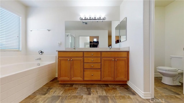 8846 Tamarisk Ave, Hesperia, CA 92344 - bathroom featuring a shower stall, a garden tub, double vanity, toilet, and stone finish floors