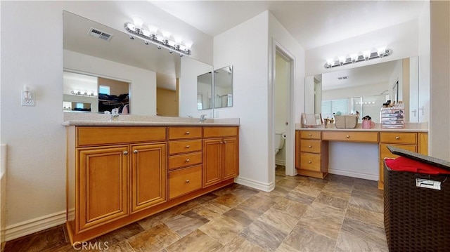 8846 Tamarisk Ave, Hesperia, CA 92344 - full bathroom featuring toilet, vanity, and baseboards