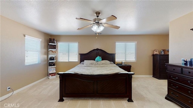 8846 Tamarisk Ave, Hesperia, CA 92344 - bedroom with light carpet, baseboards, and a ceiling fan