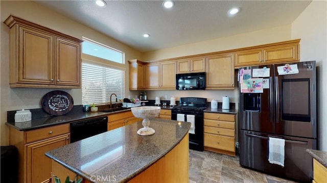 8846 Tamarisk Ave, Hesperia, CA 92344 - kitchen featuring black appliances, a sink, a kitchen island, recessed lighting, and dark stone counters