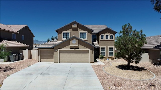 8846 Tamarisk Ave, Hesperia, CA 92344 - view of front of house featuring stucco siding, driveway, an attached garage, a tile roof, and a mountain view