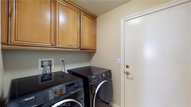 8846 Tamarisk Ave, Hesperia, CA 92344 - clothes washing area with cabinet space and washer and dryer