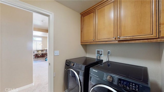 8846 Tamarisk Ave, Hesperia, CA 92344 - washroom with washer and dryer, cabinet space, carpet, and baseboards