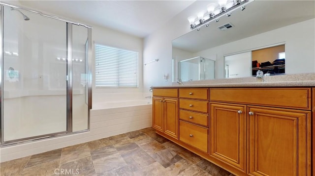 8846 Tamarisk Ave, Hesperia, CA 92344 - bathroom featuring a shower stall, a garden tub, and vanity