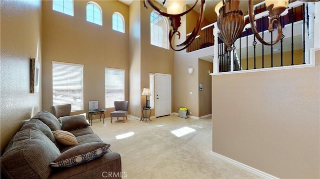 8846 Tamarisk Ave, Hesperia, CA 92344 - living room featuring a towering ceiling, carpet, and baseboards