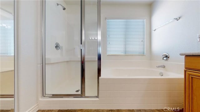 8846 Tamarisk Ave, Hesperia, CA 92344 - full bath with a stall shower, a bath, and vanity